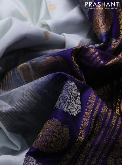 Pure gadwal silk saree off white and blue with zari woven buttas and temple design tanjore painted border