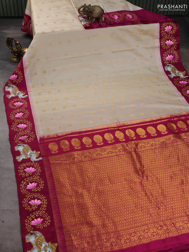 Pure gadwal silk saree cream and magenta pink with zari woven buttas and temple design tanjore painted border