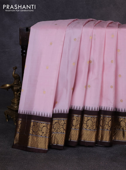 Pure gadwal silk saree mild pastel pink and coffee brown with allover zari woven buttas and temple design zari woven border
