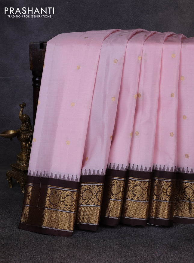 Pure gadwal silk saree mild pastel pink and coffee brown with allover zari woven buttas and temple design zari woven border