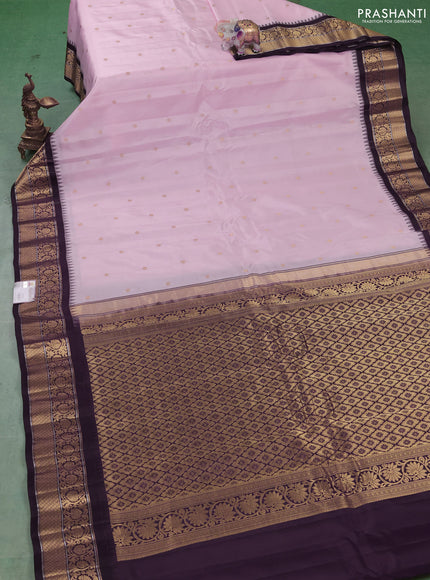 Pure gadwal silk saree mild pastel pink and coffee brown with allover zari woven buttas and temple design zari woven border