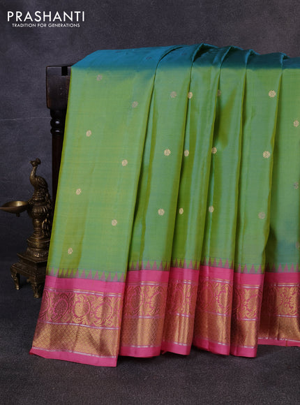 Pure gadwal silk saree dual shade of bluish yellow and peach pink with allover zari woven buttas and temple design zari woven border