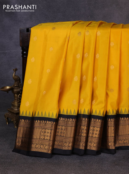 Pure gadwal silk saree yellow and black with allover zari woven buttas and temple design zari woven border