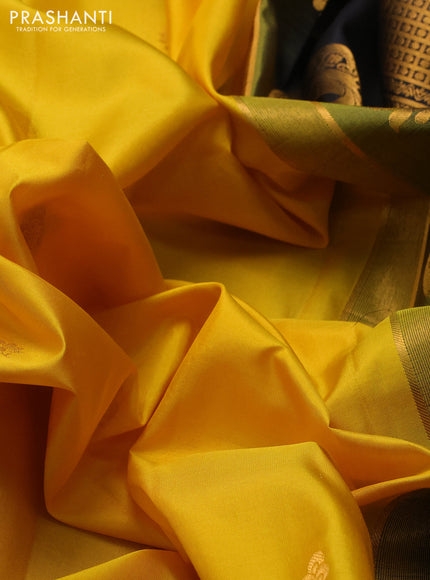 Pure gadwal silk saree yellow and black with allover zari woven buttas and temple design zari woven border