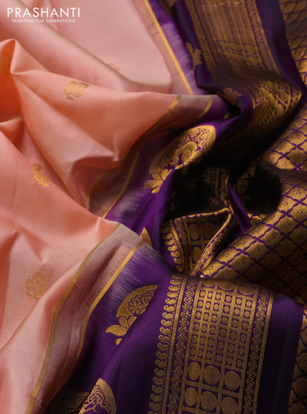 Pure gadwal silk saree peach shade and violet with allover zari woven buttas and temple design zari woven border