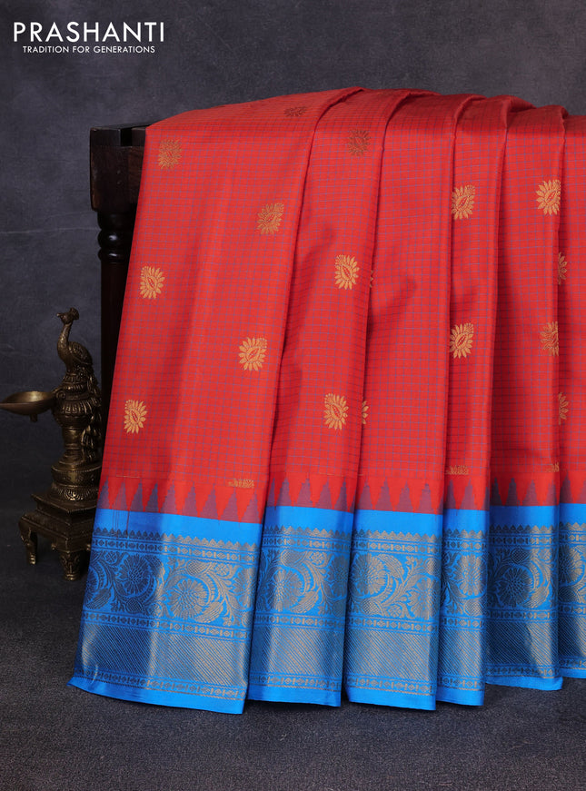 Pure gadwal silk saree orange and teal blue with allover checks & zari buttas and temple design zari woven border