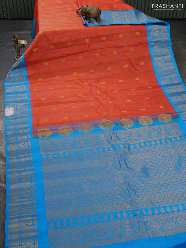 Pure gadwal silk saree orange and teal blue with allover checks & zari buttas and temple design zari woven border