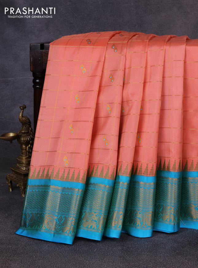 Pure gadwal silk saree peach orange and teal blue with allover zari checks & buttas and temple design zari woven border