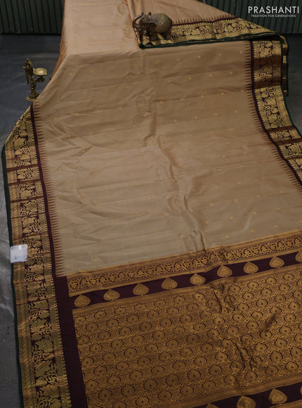 Pure gadwal silk saree sandal and deep wine with zari woven buttas and temple design zari woven border