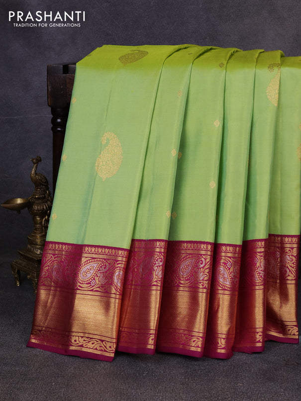 Pure gadwal silk saree pista green and dark magenta with allover zari woven buttas and rich zari woven border