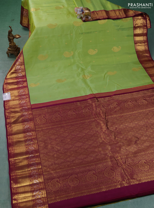 Pure gadwal silk saree pista green and dark magenta with allover zari woven buttas and rich zari woven border