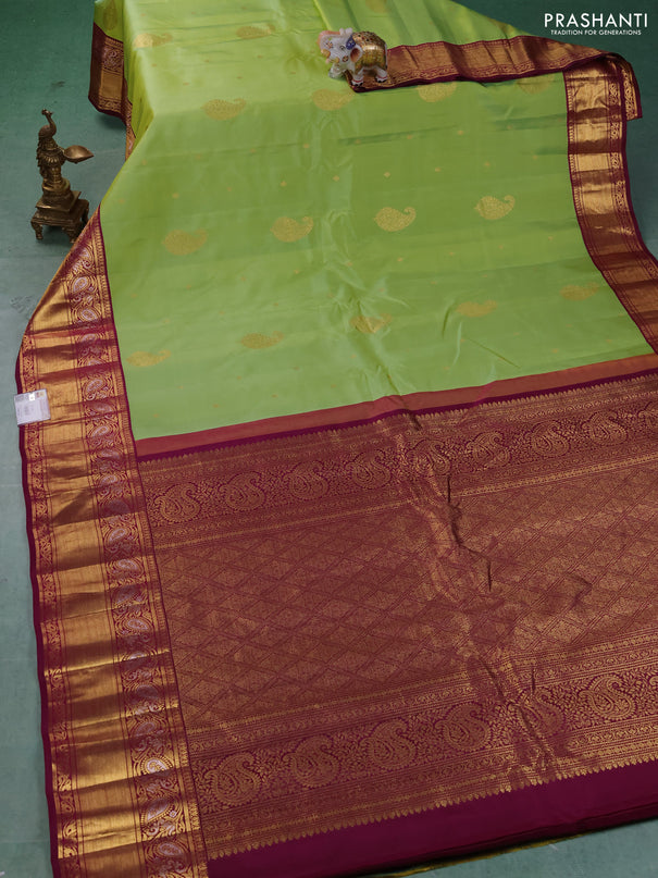 Pure gadwal silk saree pista green and dark magenta with allover zari woven buttas and rich zari woven border