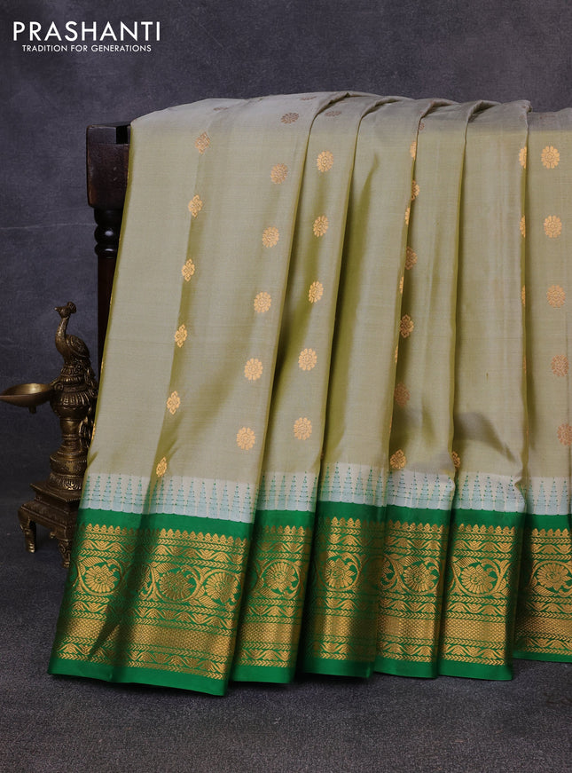 Pure gadwal silk saree pista green and green with zari woven buttas and temple design zari woven border