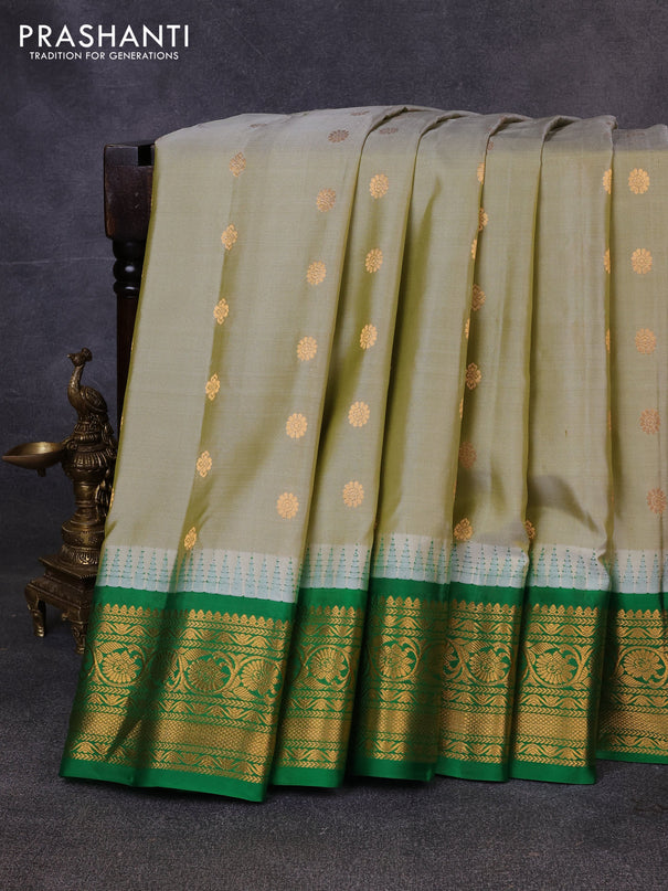 Pure gadwal silk saree pista green and green with zari woven buttas and temple design zari woven border