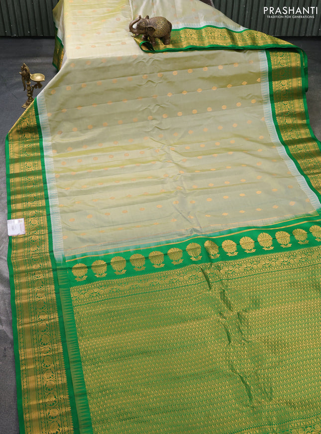Pure gadwal silk saree pista green and green with zari woven buttas and temple design zari woven border