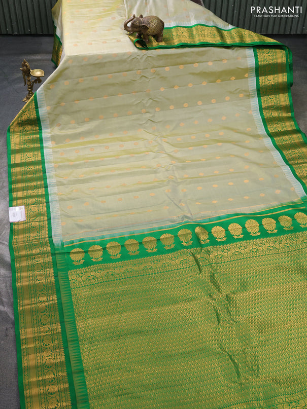 Pure gadwal silk saree pista green and green with zari woven buttas and temple design zari woven border