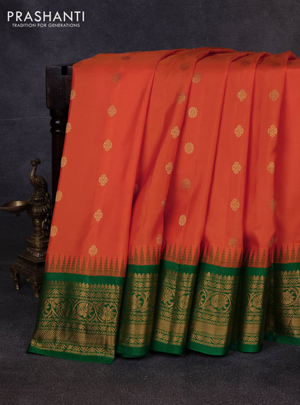 Pure gadwal silk saree orange and green with allover zari woven buttas and temple design zari woven border