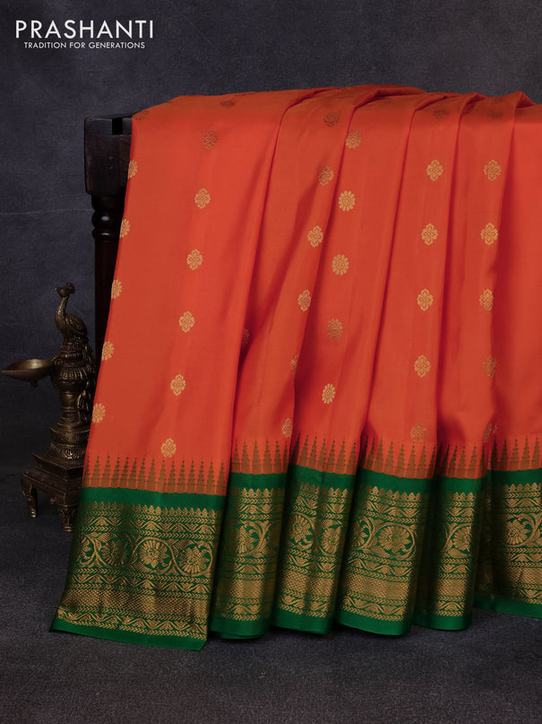 Pure gadwal silk saree orange and green with allover zari woven buttas and temple design zari woven border