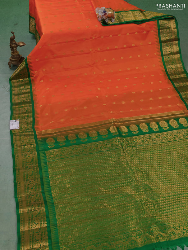 Pure gadwal silk saree orange and green with allover zari woven buttas and temple design zari woven border