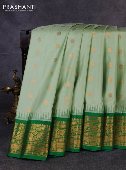 Pure gadwal silk saree pastel green and green with allover zari woven buttas and temple design zari woven border