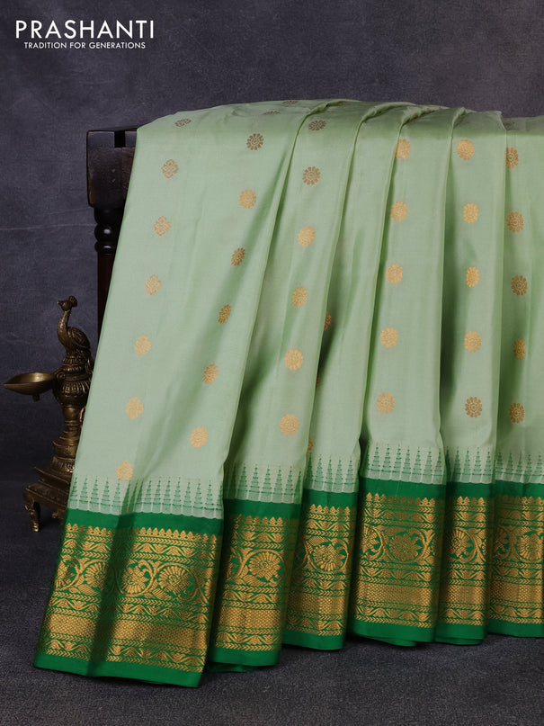 Pure gadwal silk saree pastel green and green with allover zari woven buttas and temple design zari woven border