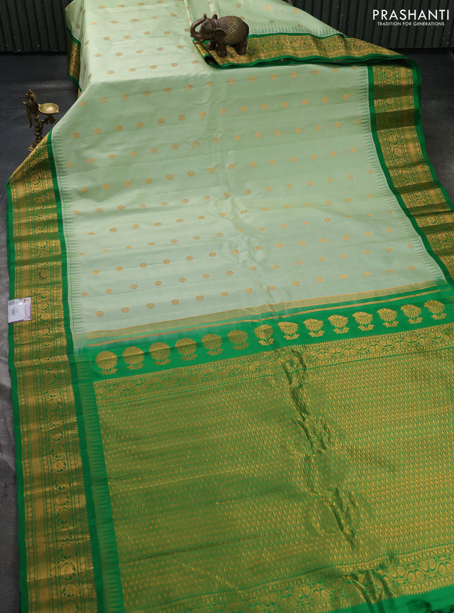 Pure gadwal silk saree pastel green and green with allover zari woven buttas and temple design zari woven border