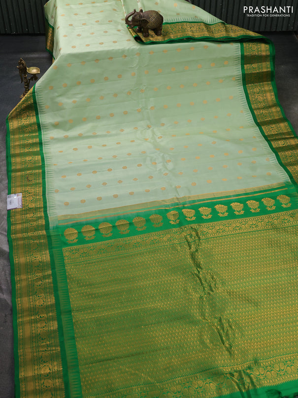Pure gadwal silk saree pastel green and green with allover zari woven buttas and temple design zari woven border