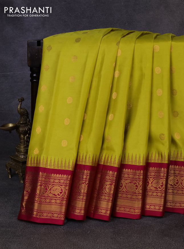 Pure gadwal silk saree lime green and dark pink with allover zari woven buttas and temple design zari woven border