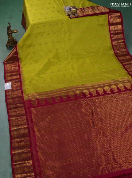 Pure gadwal silk saree lime green and dark pink with allover zari woven buttas and temple design zari woven border