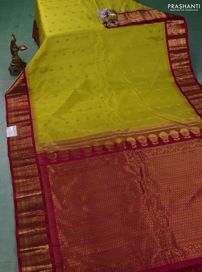 Pure gadwal silk saree lime green and dark pink with allover zari woven buttas and temple design zari woven border