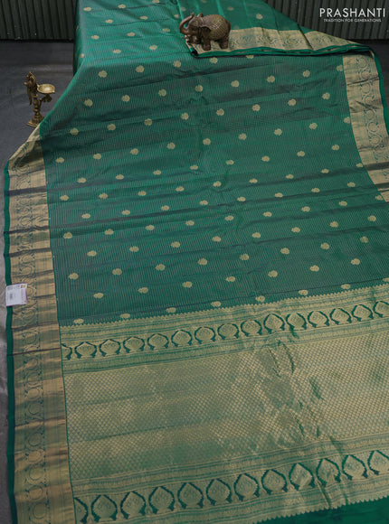 Pure gadwal silk saree peacock green with allover small zari checks & buttas and zari woven border