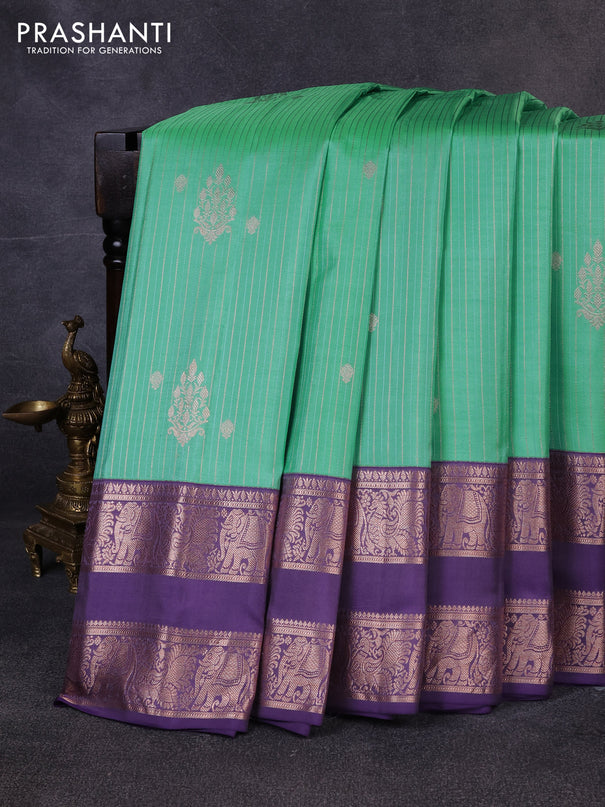 Pure gadwal silk saree teal green and pastel purple with allover zari stripes pattern & buttas and rettapet zari woven border