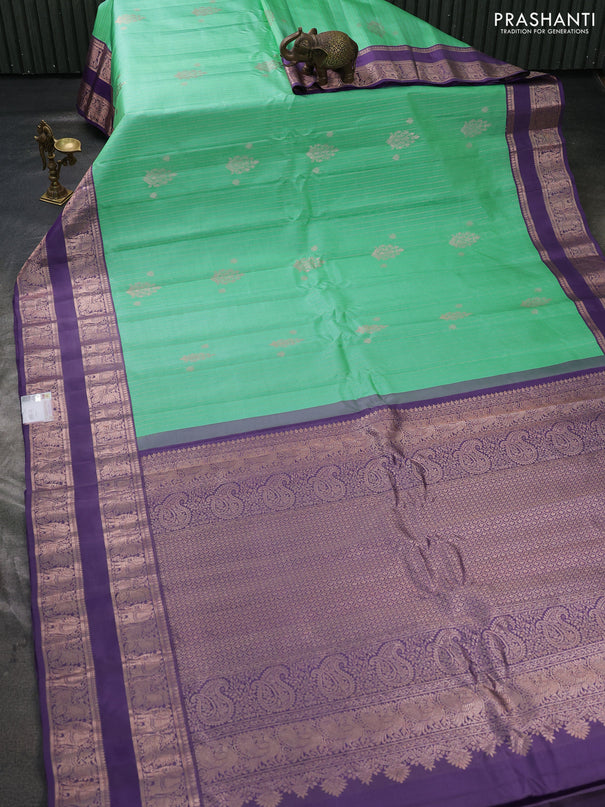 Pure gadwal silk saree teal green and pastel purple with allover zari stripes pattern & buttas and rettapet zari woven border