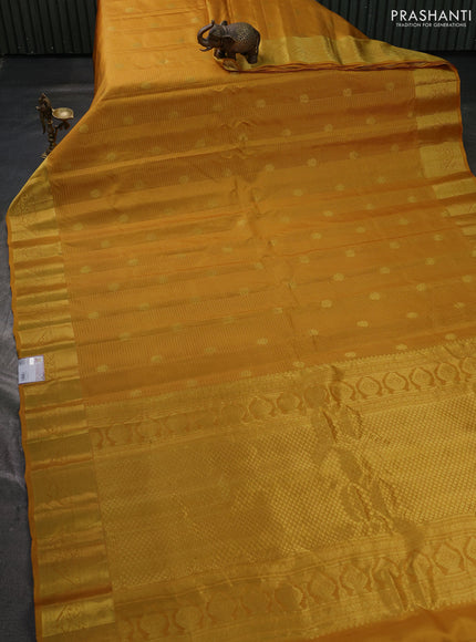 Pure gadwal silk saree mustard yellow with allover zari checks & buttas and zari woven border