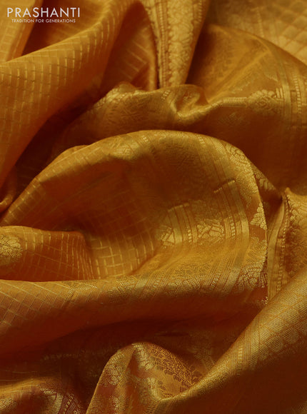 Pure gadwal silk saree mustard yellow with allover zari checks & buttas and zari woven border