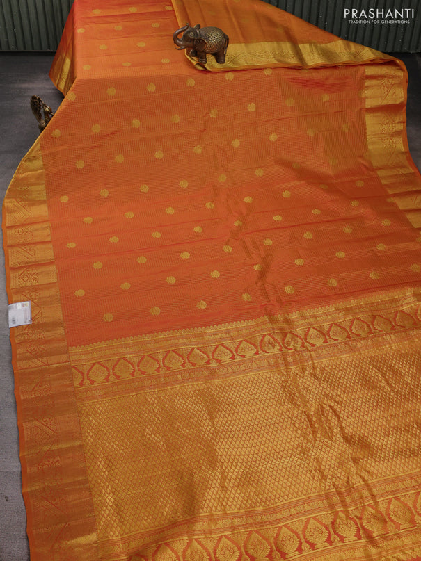 Pure gadwal silk saree sunset orange with allover zari checks & buttas and zari woven border