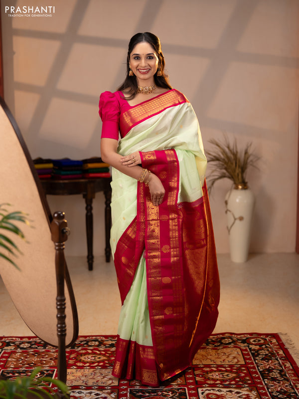 Pure gadwal silk saree pista green and dark pink with allover silver & zari woven buttas and rettapet zari woven korvai butta border