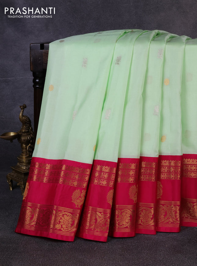 Pure gadwal silk saree pista green and dark pink with allover silver & zari woven buttas and rettapet zari woven korvai butta border