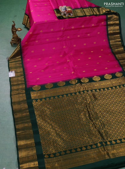Pure gadwal silk saree dark pink and bottle green with allover zari woven buttas and temple design zari woven border