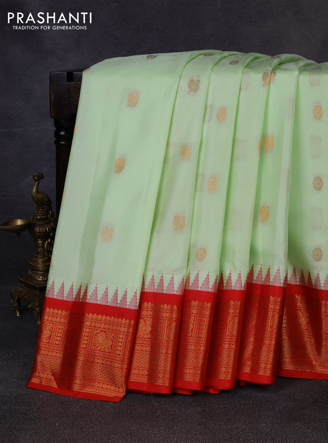 Pure gadwal silk saree pista green and red with allover zari woven buttas and temple design zari woven border