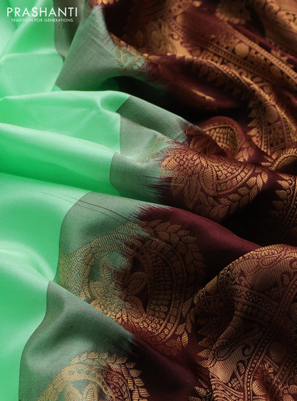 Pure gadwal silk saree pista green and coffee brown with allover annam zari woven buttas and temple design zari woven border