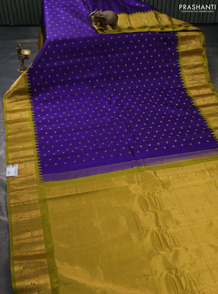 Pure gadwal silk saree violet and mehendi green with allover zari woven buttas and temple design zari woven border