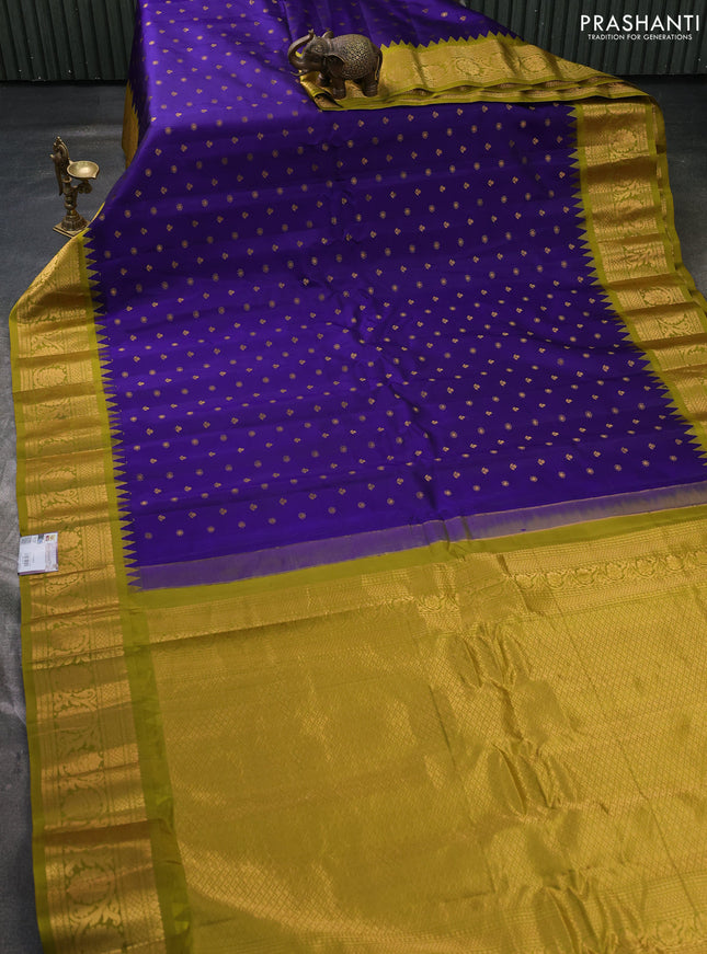 Pure gadwal silk saree violet and mehendi green with allover zari woven buttas and temple design zari woven border