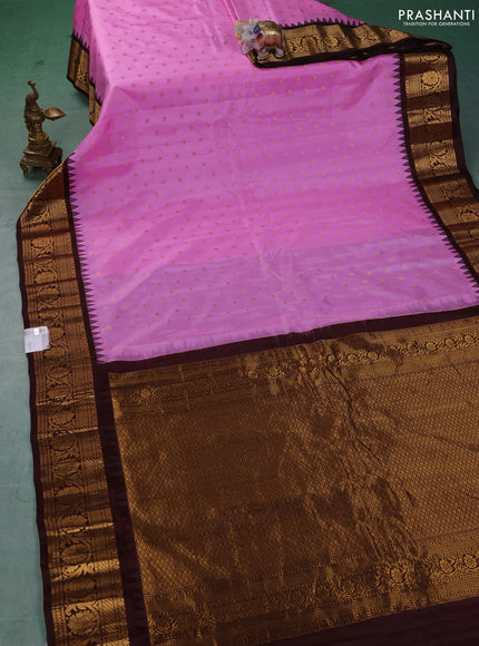 Pure gadwal silk saree lotus pink and coffee brown with allover zari woven buttas and temple design zari woven border