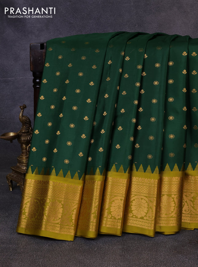 Pure gadwal silk saree bottle green and mehendi green with allover zari woven buttas and temple design zari woven border