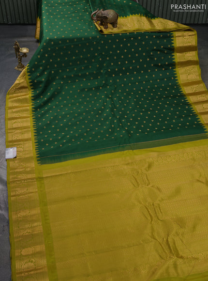 Pure gadwal silk saree bottle green and mehendi green with allover zari woven buttas and temple design zari woven border