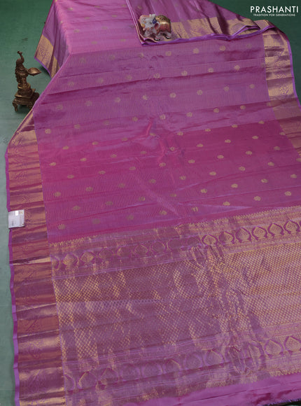 Pure gadwal silk saree dual shade of lavender with allover zari checks & buttas and zari woven border