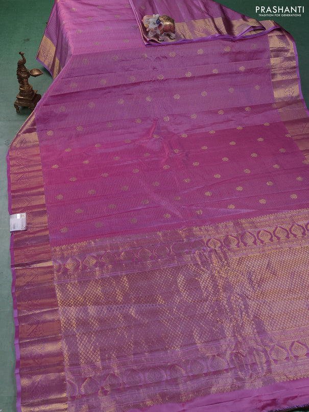 Pure gadwal silk saree dual shade of lavender with allover zari checks & buttas and zari woven border