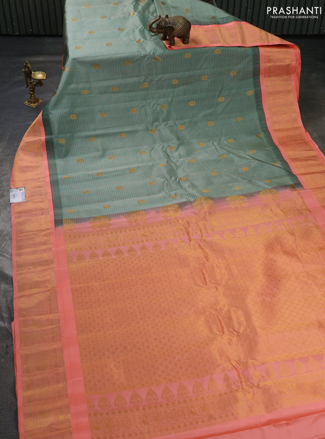 Pure gadwal silk saree green shade and peach orange with allover checks & buttas and temple design zari woven border