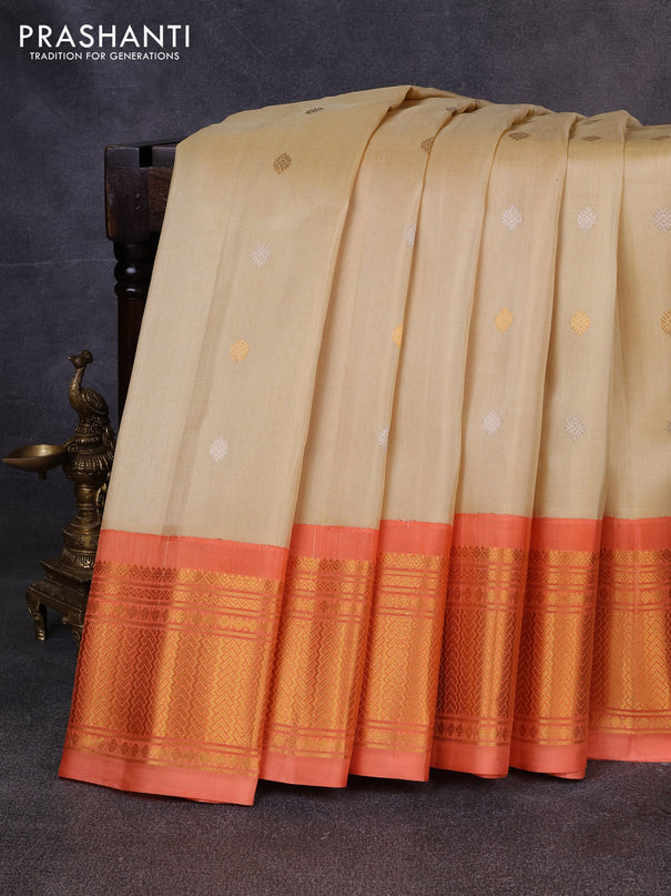 Pure gadwal silk saree cream and peach orange with allover silver & zari woven buttas and zari woven korvai border